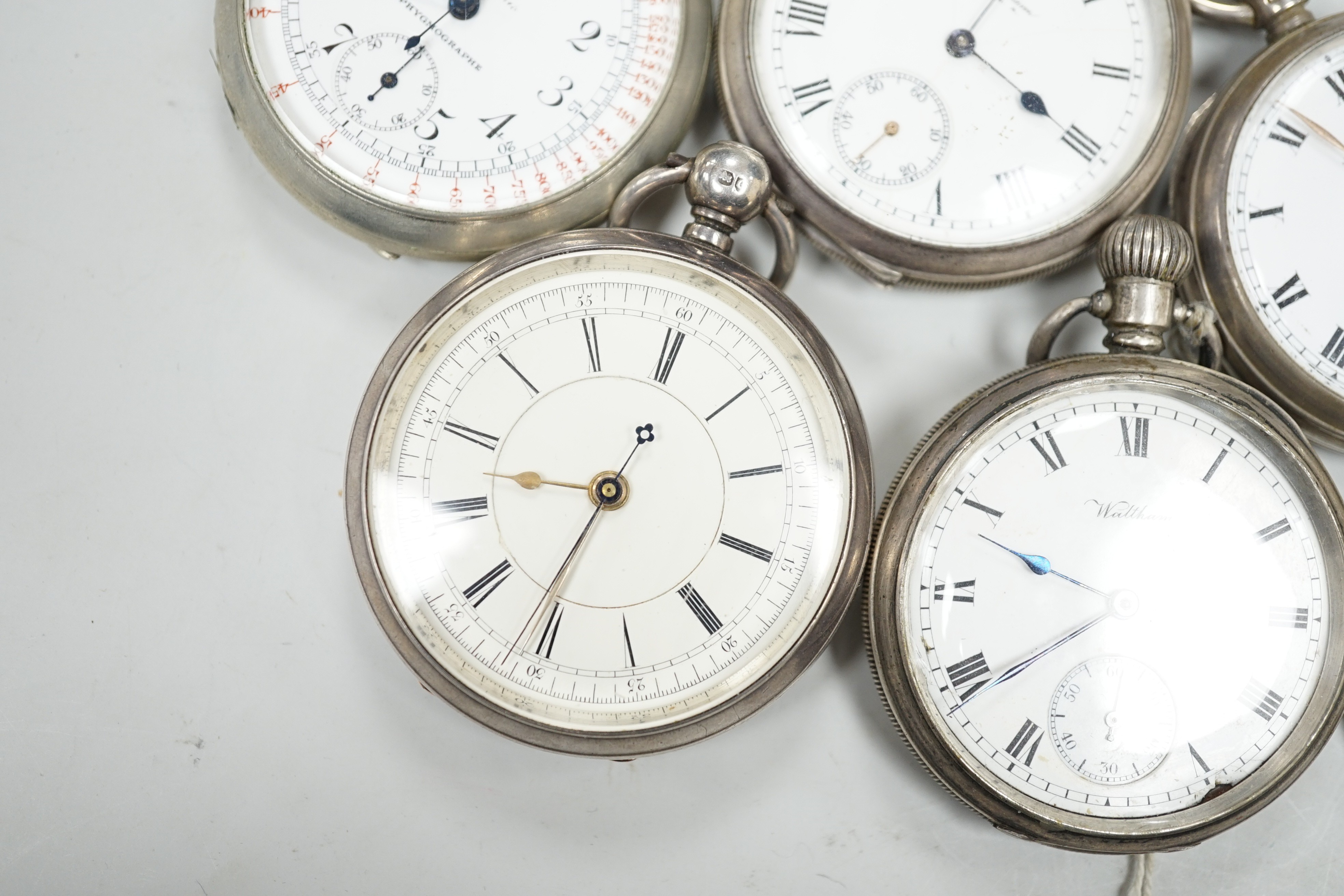 Four assorted silver open faced pocket watches including two Waltham and a J.W. Benson and two other base metal pocket watches.